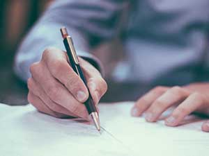 signing pen hands